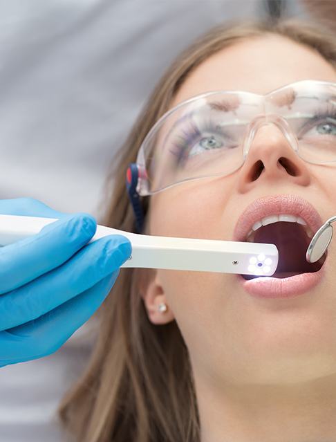 Dentist using intraoral camera to capture smile images