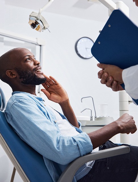 Man smiling at the dentist