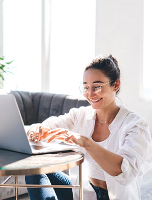 woman smiling while working at home