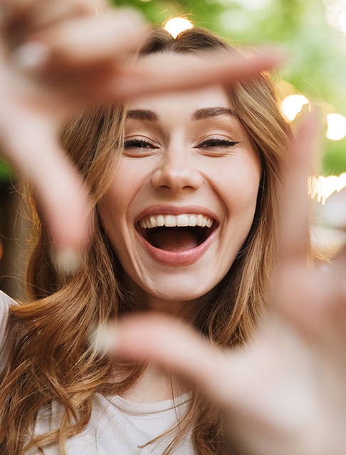 Woman sharing smile after porcelain veneers