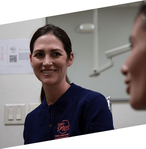 Doctor Fitzgerald smiling at a dental patient