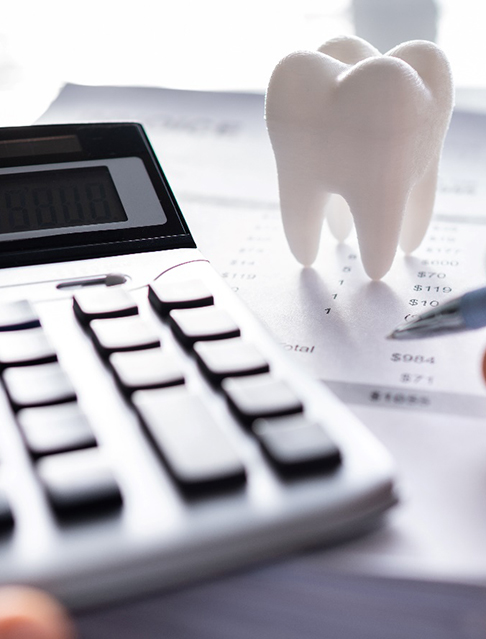 A patient calculating the cost of dental crowns