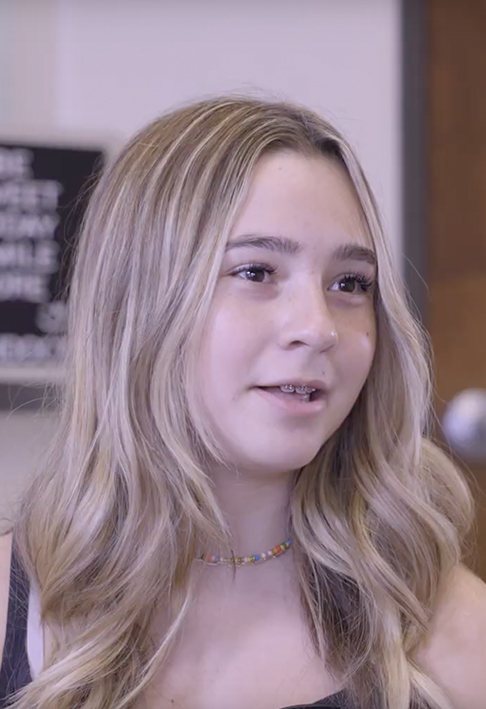 Young blonde woman with braces