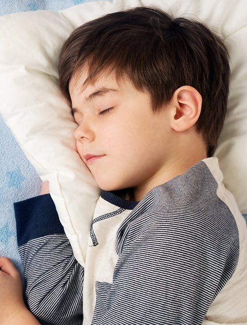 Child with sleep disordered breathing sleeping soundly after orthodontic treatment