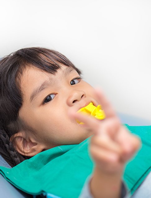 Young patient receiving fluoride treatment