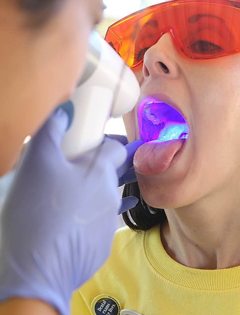 Patient receiving oral cancer screening