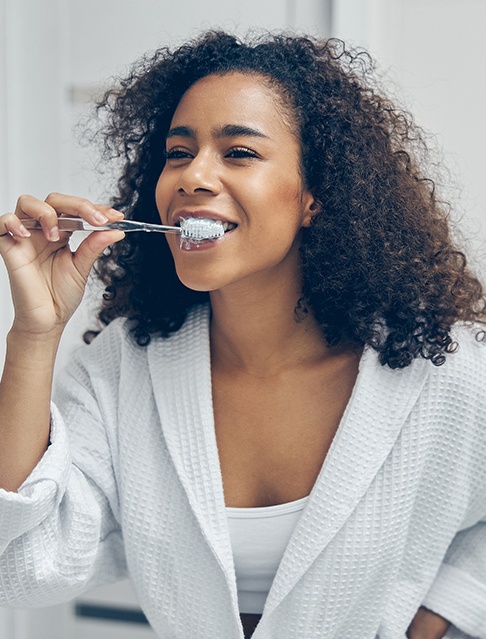 Woman brushing her teeth