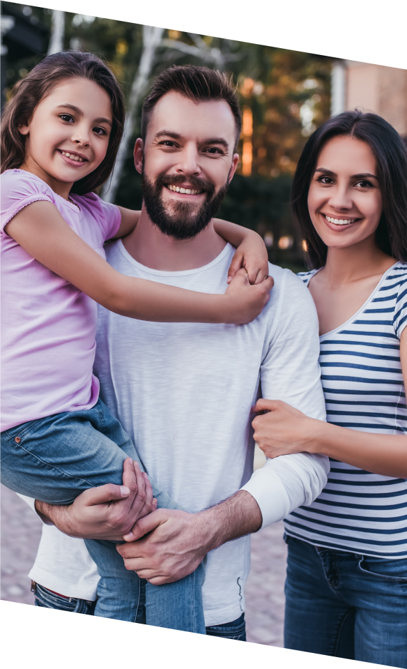 Family of three smiling after dental services in Marana Arizona