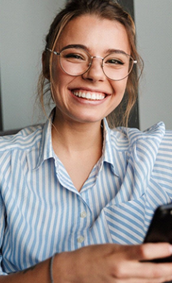 woman smiling after getting veneers in Marana