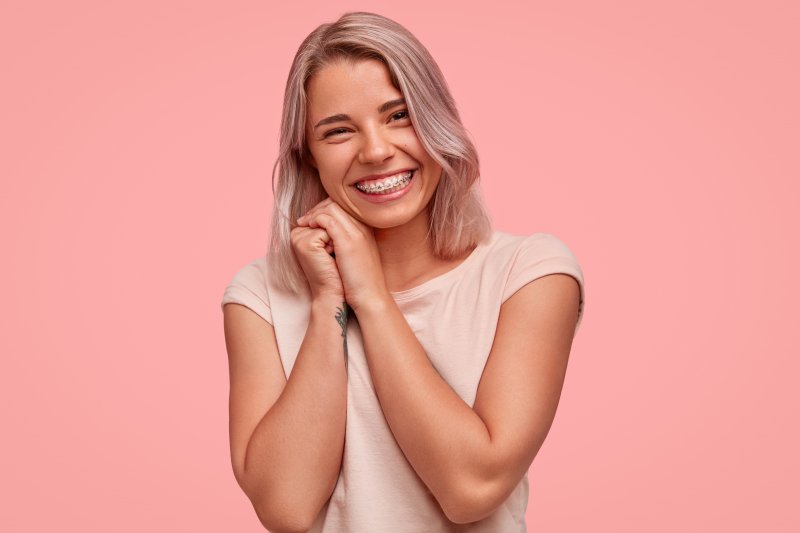 young woman with braces in Marana smiling 