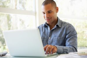 man looking at computer 