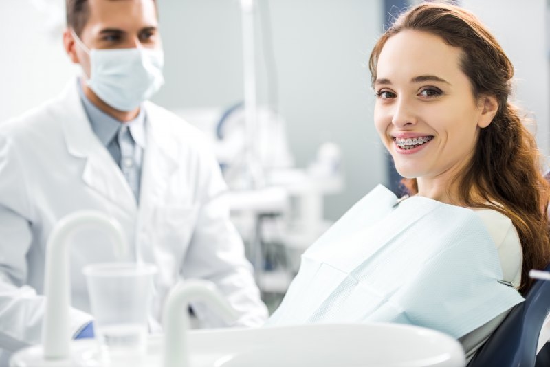 Patient smiling with their braces treatment